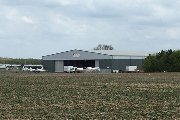 Architect returns to view progress on airfield hangar